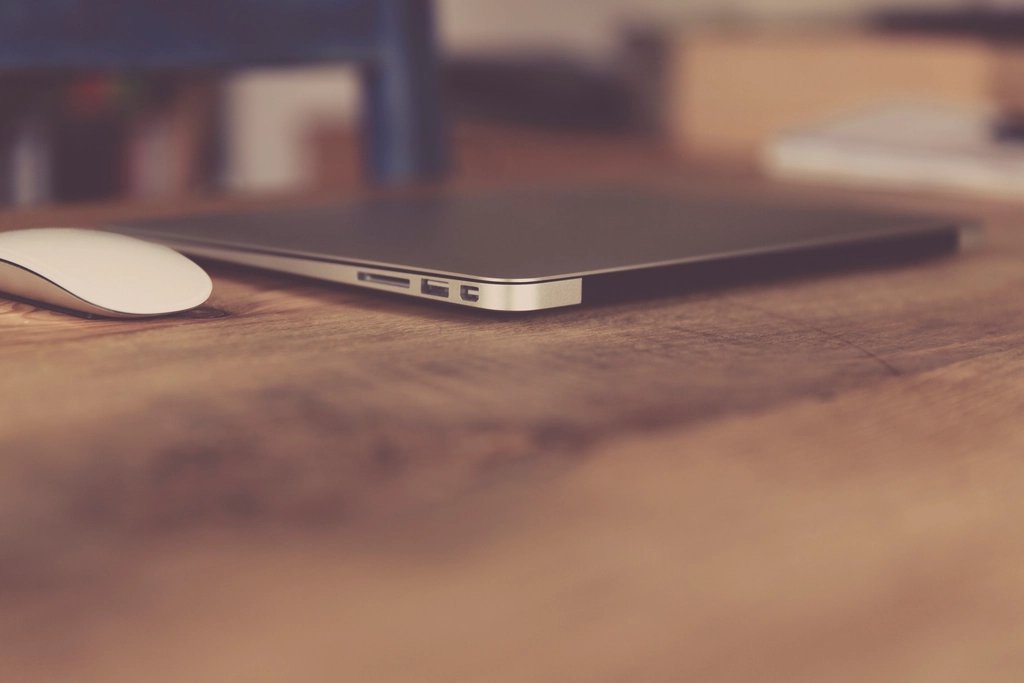Laptop and mouse on a desk